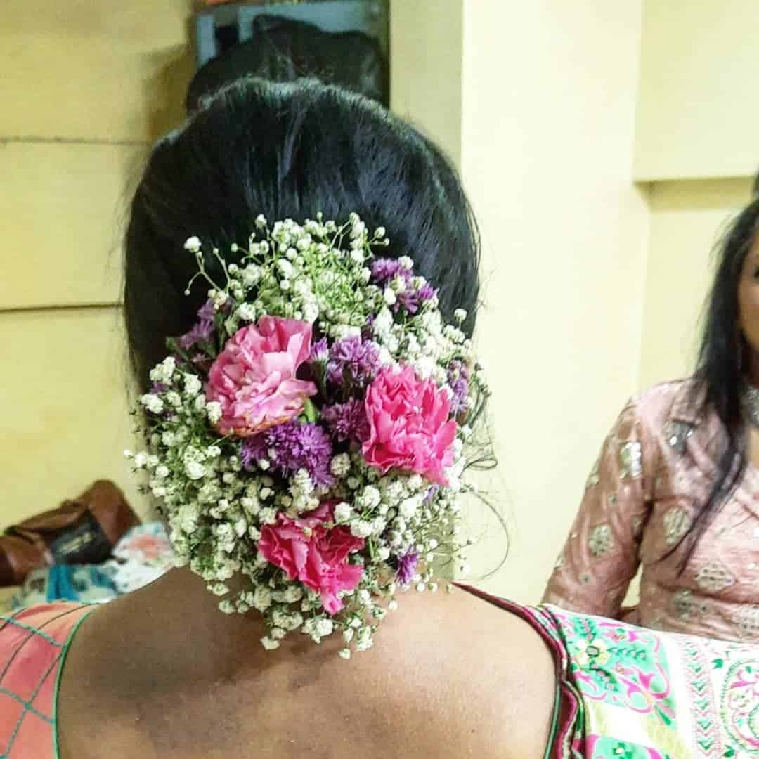 Sleek Up Bun With Flower Details 